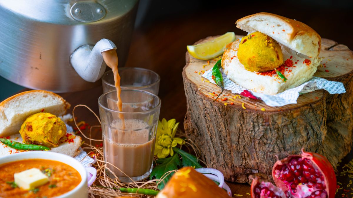 Vada pav and chai arranged on a rustic table